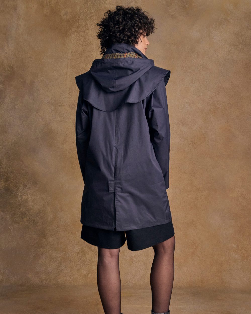Heritage Navy Coloured Jack Murphy Cotswold Ladies Waterproof 3/4 Coat on indoor background 