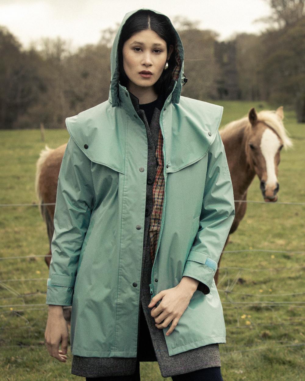 Smoke Blue Coloured Jack Murphy Cotswold Ladies Waterproof 3/4 Coat on outdoor background 