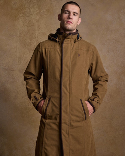 Camel Coloured Jack Murphy Emmet Waterproof Long Coat on indoor background 