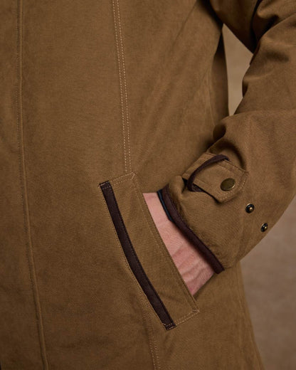 Camel Coloured Jack Murphy Emmet Waterproof Long Coat on indoor background 