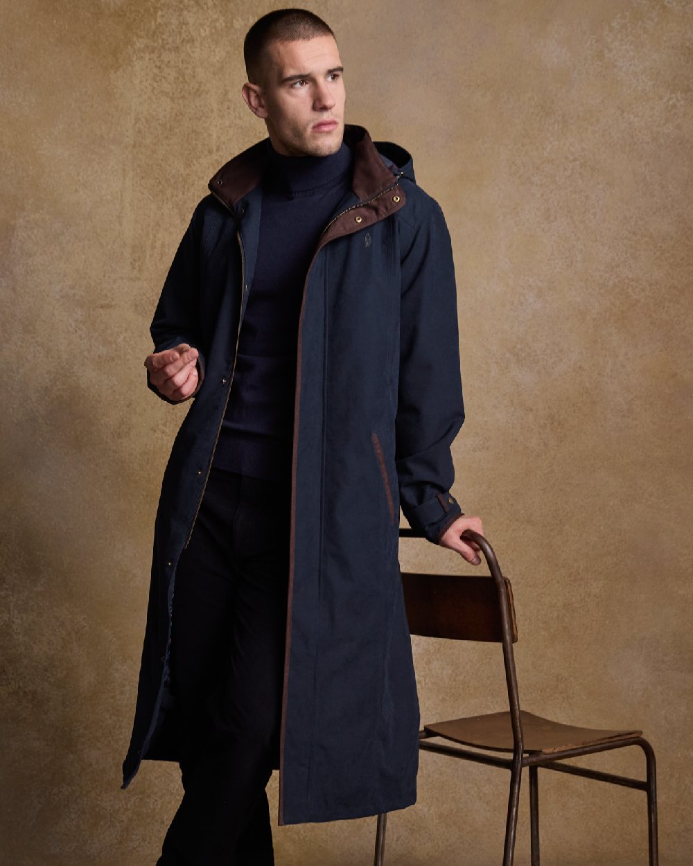 Navy Coloured Jack Murphy Emmet Waterproof Long Coat on indoor background 