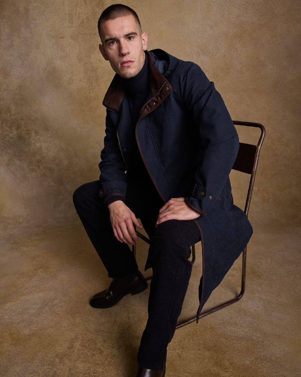 Navy Coloured Jack Murphy Emmet Waterproof Long Coat on indoor background 