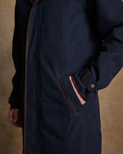 Navy Coloured Jack Murphy Emmet Waterproof Long Coat on indoor background 