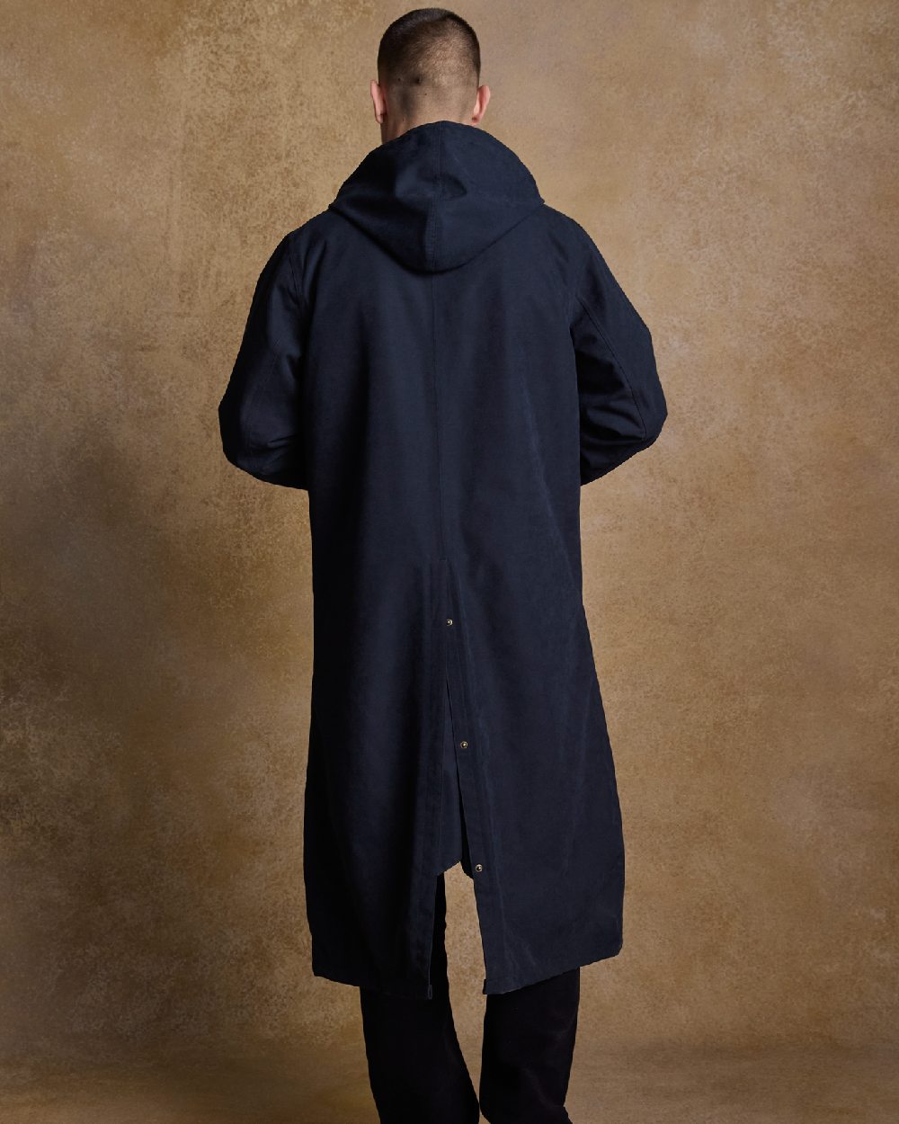 Navy Coloured Jack Murphy Emmet Waterproof Long Coat on indoor background 