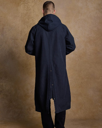Navy Coloured Jack Murphy Emmet Waterproof Long Coat on indoor background 