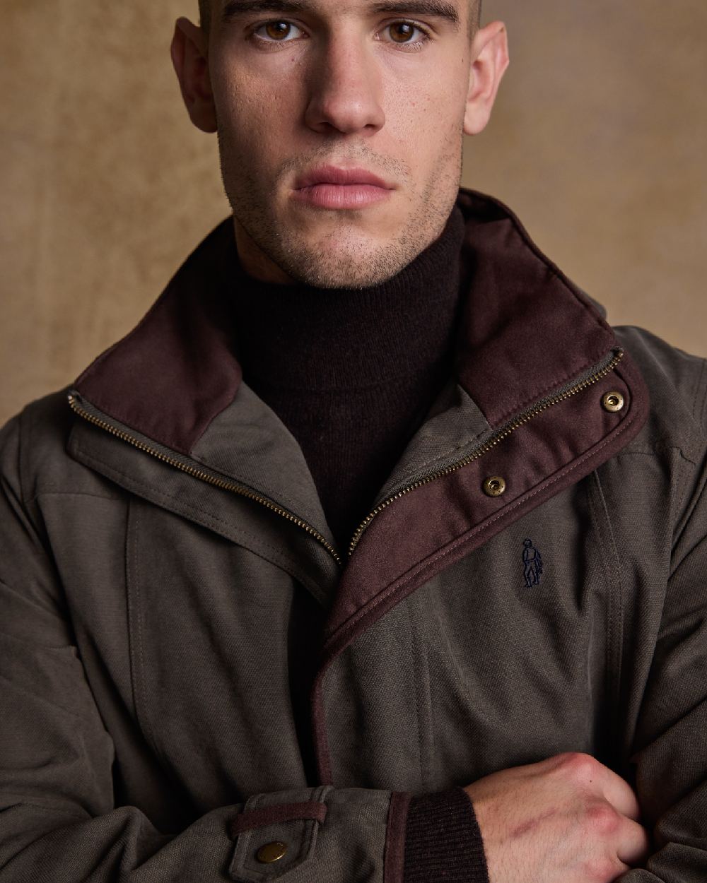 Olive Coloured Jack Murphy Emmet Waterproof Long Coat on indoor background 