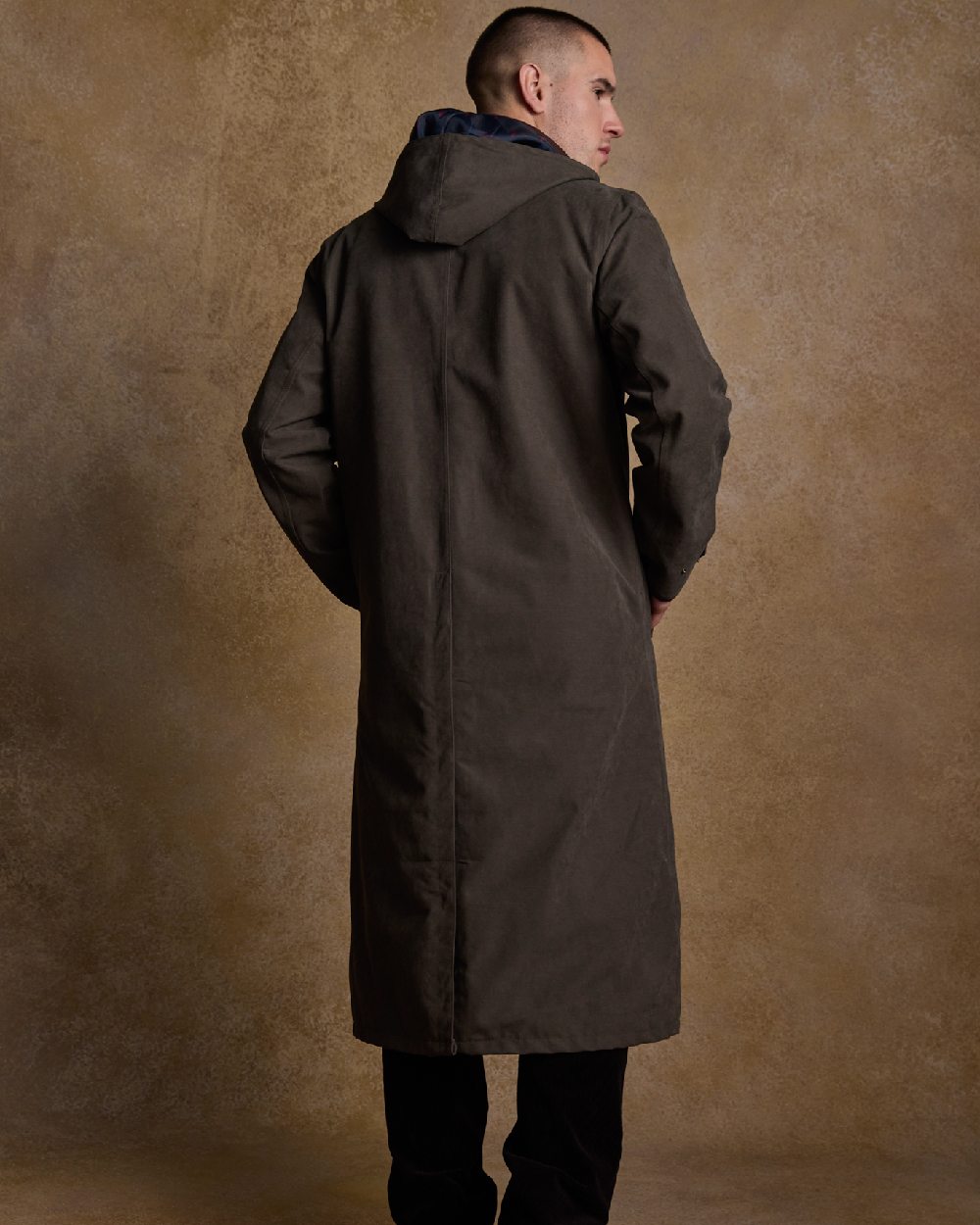 Olive Coloured Jack Murphy Emmet Waterproof Long Coat on indoor background 