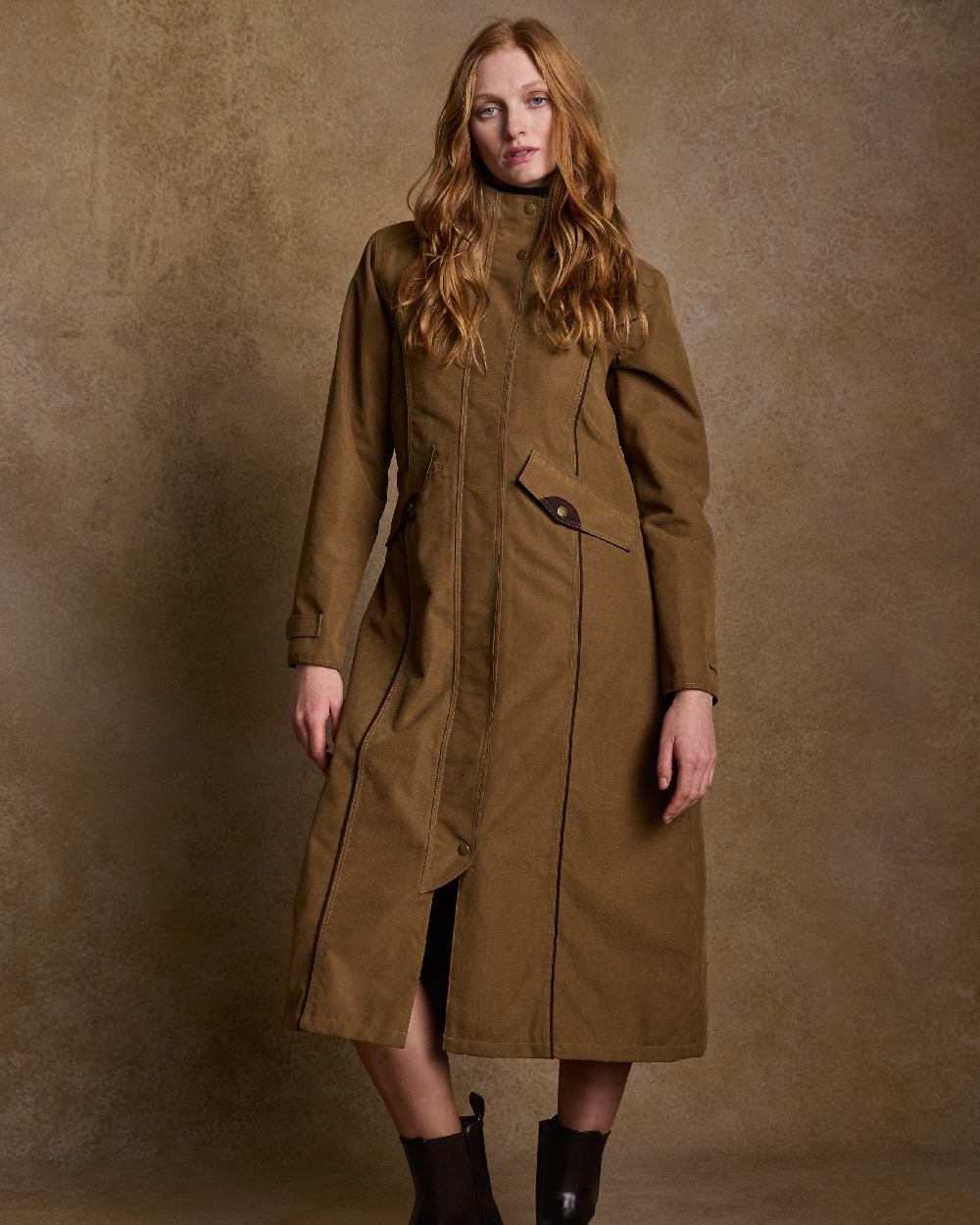 Camel Coloured Jack Murphy Erin Long Waterproof Coat on indoor background 