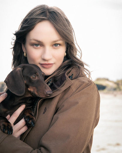 Camel Coloured Jack Murphy Erin Long Waterproof Coat on outdoor background 