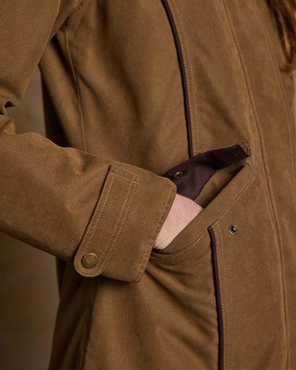 Camel Coloured Jack Murphy Erin Long Waterproof Coat on indoor background 