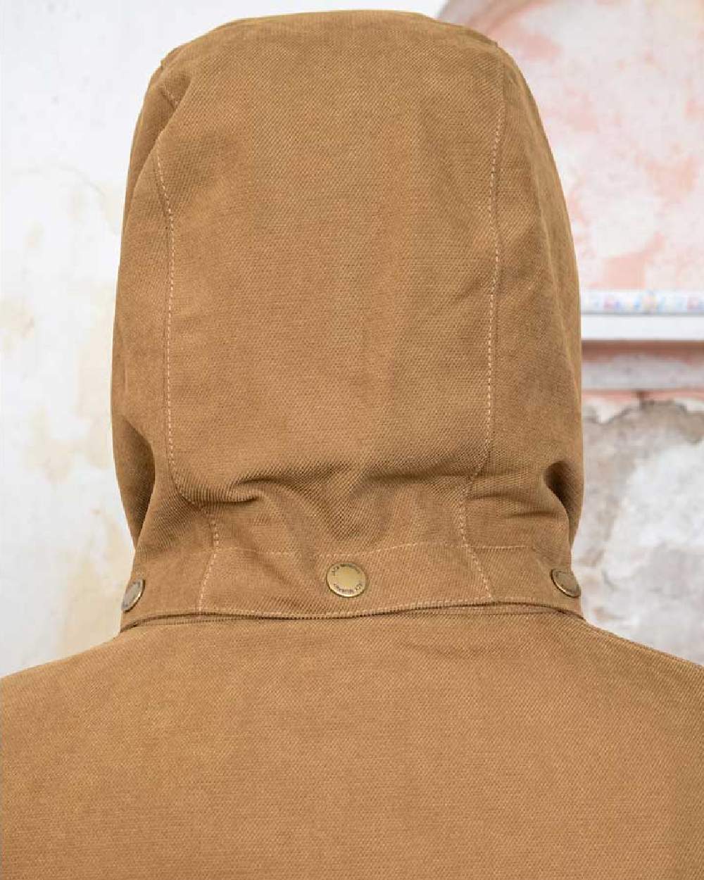 Camel coloured Jack Murphy Erin Long Waterproof Coat on wall background 