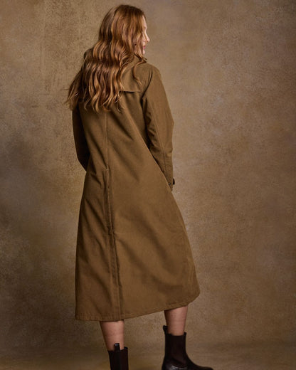 Camel Coloured Jack Murphy Erin Long Waterproof Coat on indoor background 