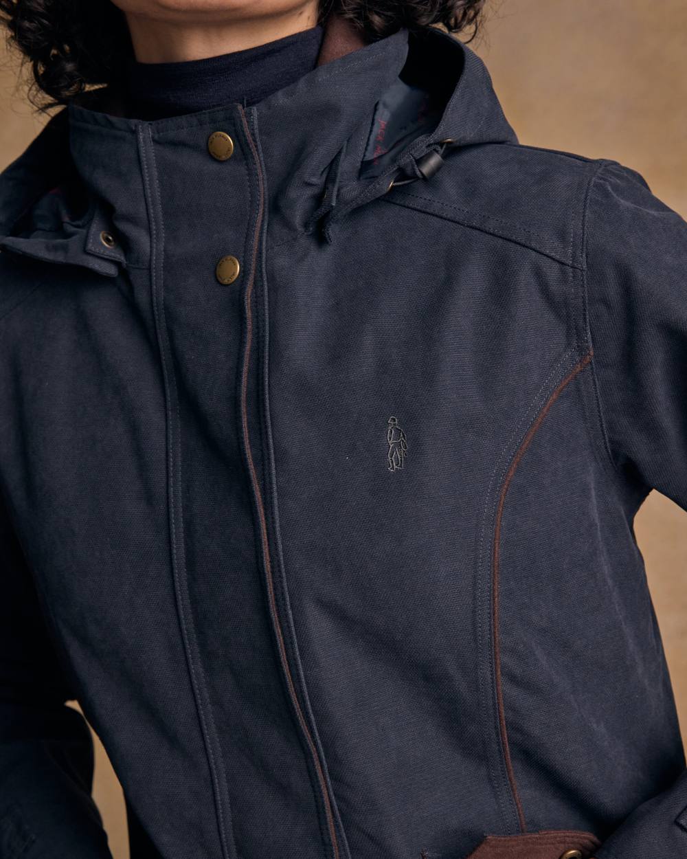 Heritage Navy coloured Jack Murphy Erin Long Waterproof Coat on wall background 