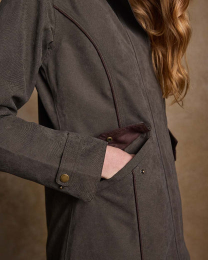 Olive Coloured Jack Murphy Erin Long Waterproof Coat on indoor background 