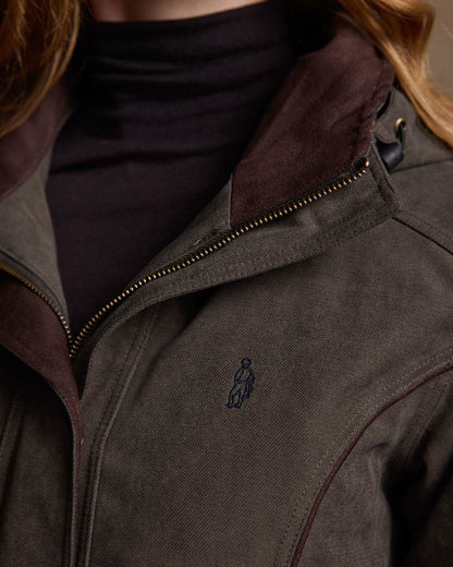 Olive Coloured Jack Murphy Erin Long Waterproof Coat on indoor background 