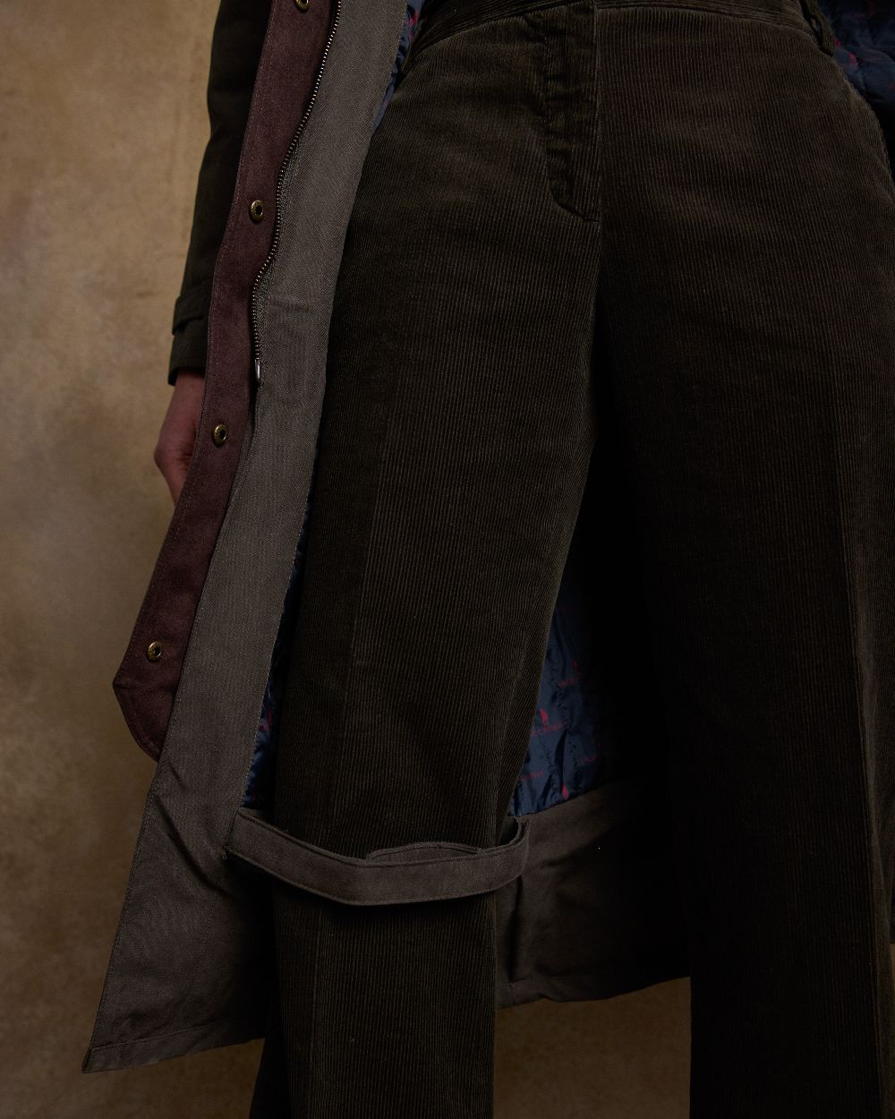Olive Coloured Jack Murphy Erin Long Waterproof Coat on indoor background 