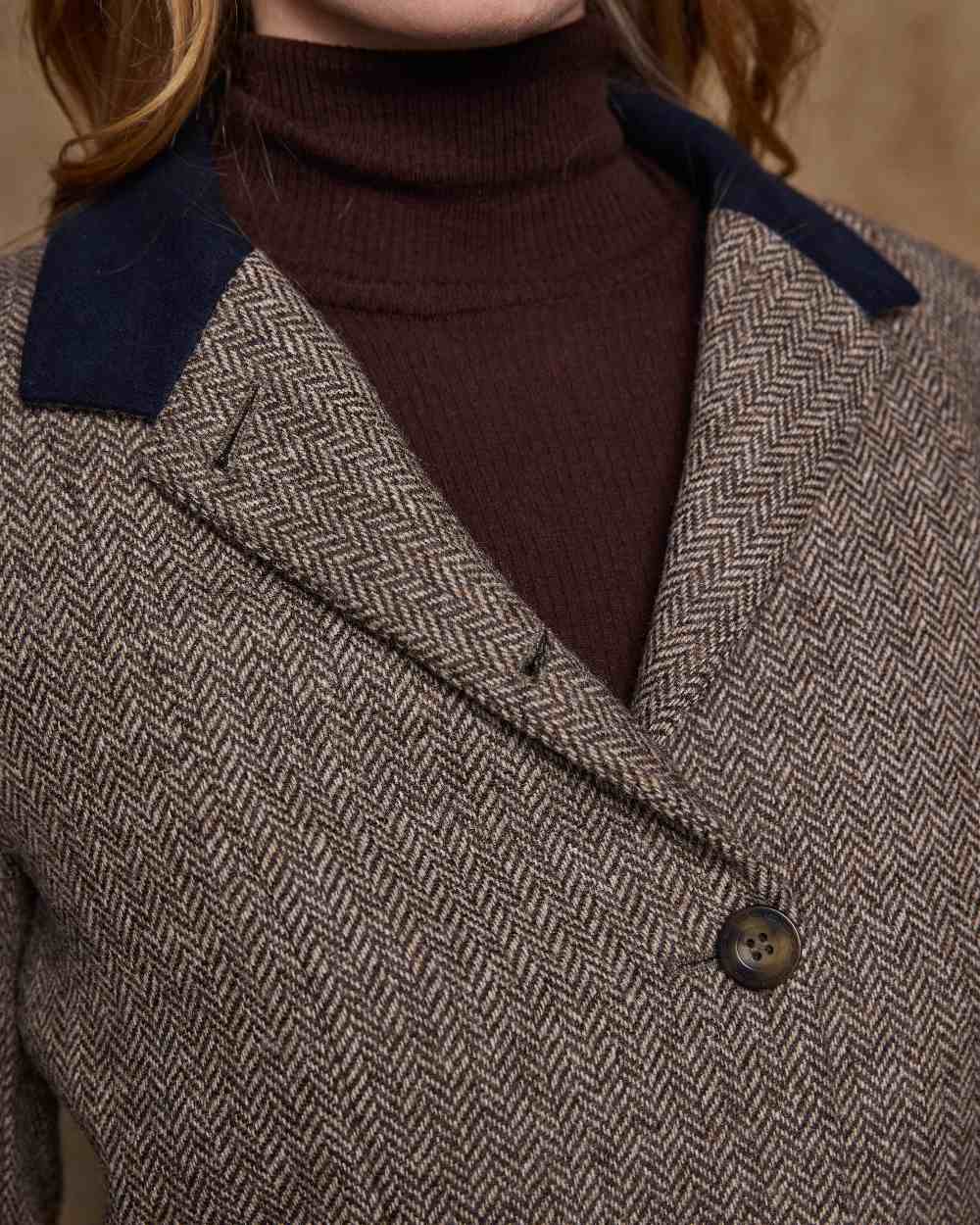 Light Tan Herringbone Coloured Jack Murphy Isabella Tweed Coat on indoor background 