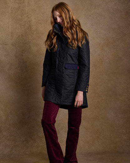 Navy Coloured Jack Murphy Jodie Wax Coat on indoor background 