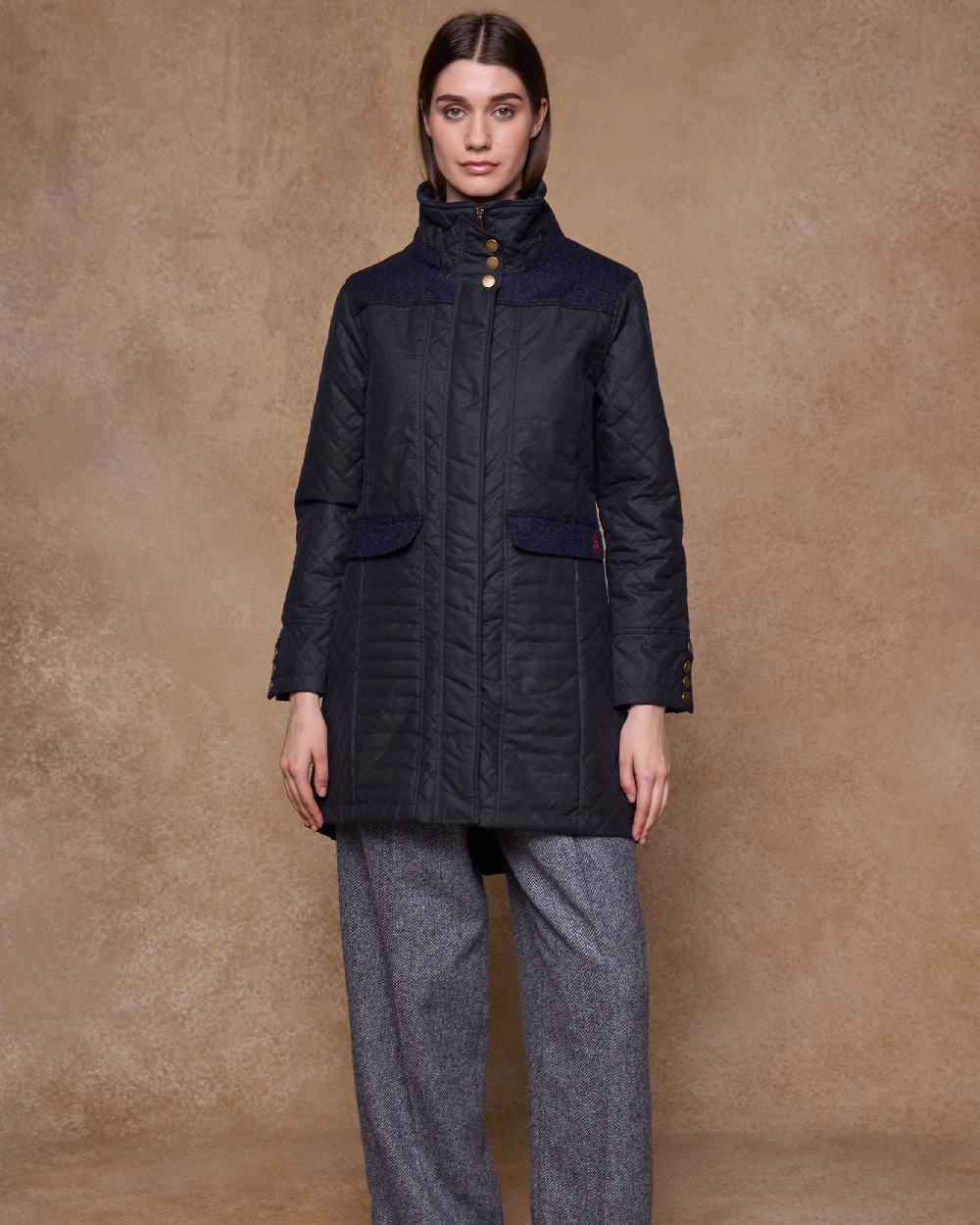 Navy Coloured Jack Murphy Jodie Wax Coat on indoor background 