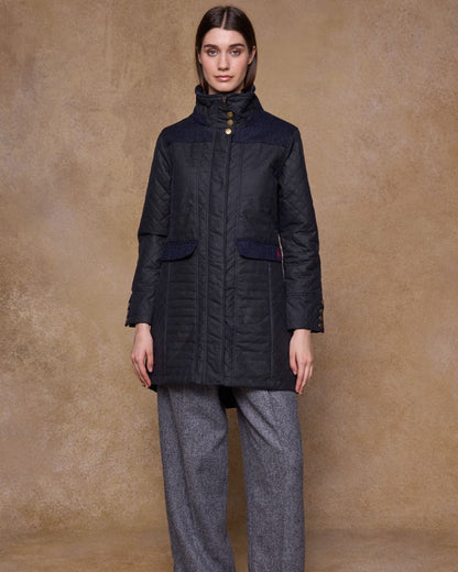 Navy Coloured Jack Murphy Jodie Wax Coat on indoor background 