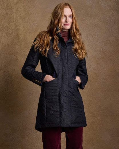 Navy Coloured Jack Murphy Jodie Wax Coat on indoor background 