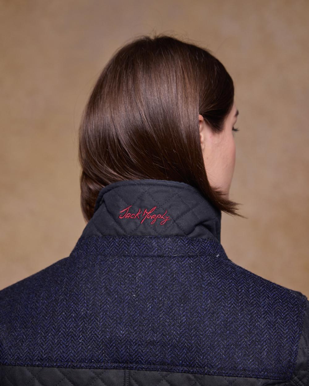 Navy Coloured Jack Murphy Jodie Wax Coat on indoor background 