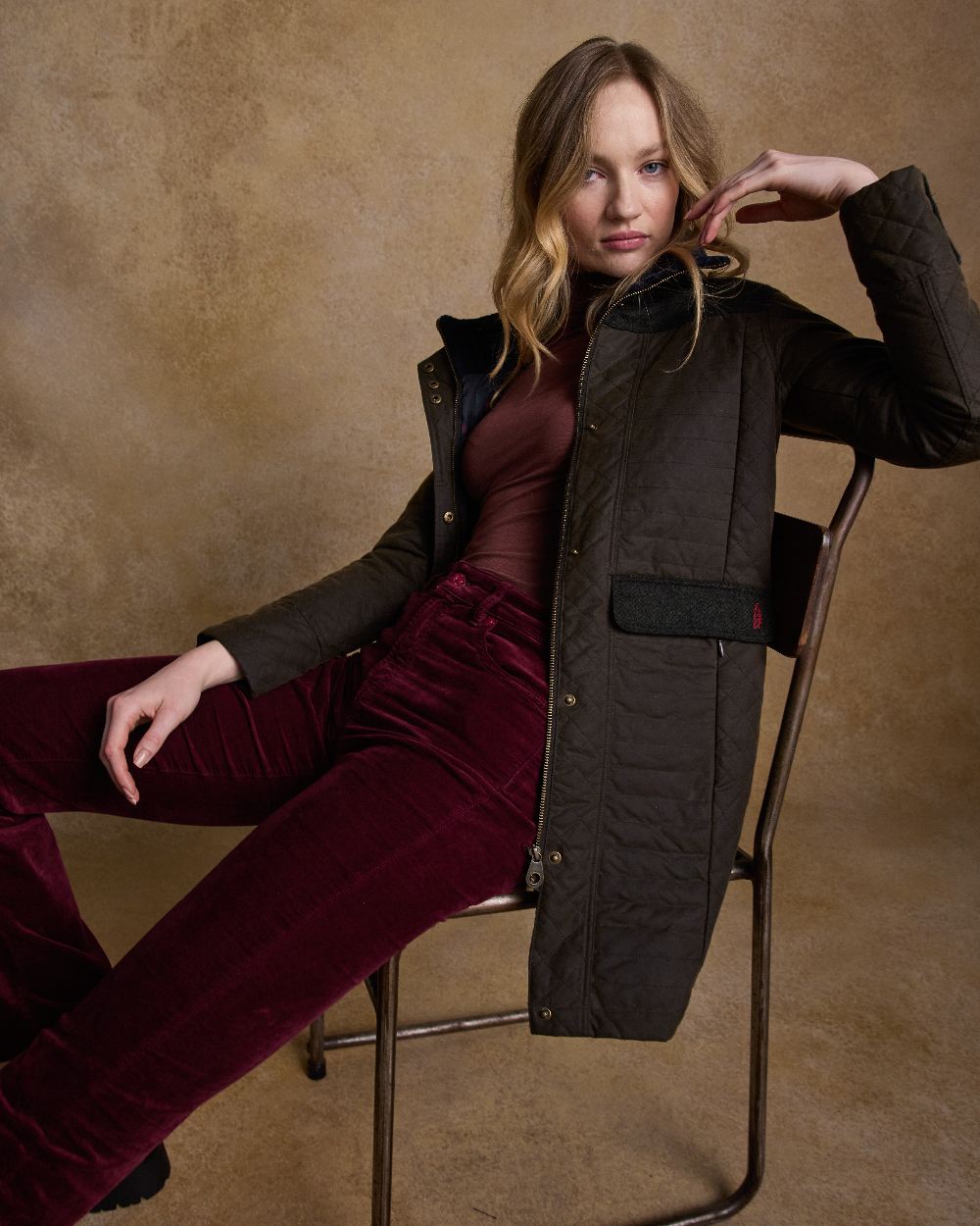 Olive Coloured Jack Murphy Jodie Wax Coat on indoor background 
