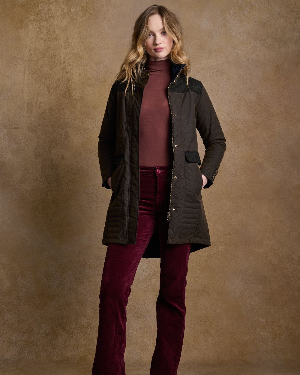 Olive Coloured Jack Murphy Jodie Wax Coat on indoor background 
