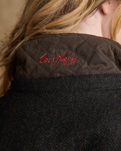 Olive Coloured Jack Murphy Jodie Wax Coat on indoor background 