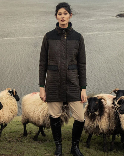 Olive Coloured Jack Murphy Jodie Wax Coat on sea background 