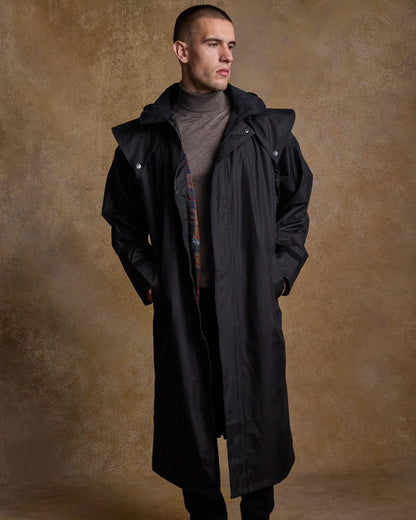 Black Coloured Jack Murphy Lambourne Mens Long Bush Coat on indoor background 