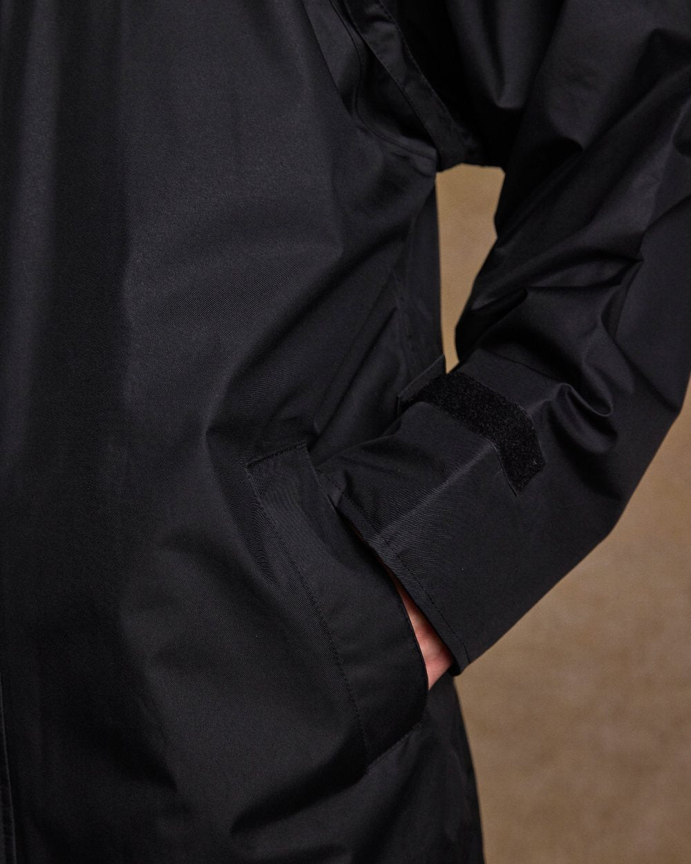 Black Coloured Jack Murphy Lambourne Mens Long Bush Coat on indoor background 