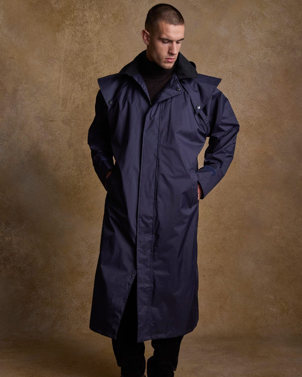 Navy Coloured Jack Murphy Lambourne Mens Long Bush Coat on indoor background 