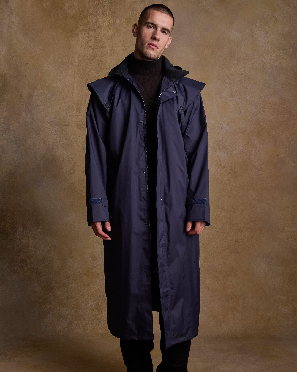 Navy Coloured Jack Murphy Lambourne Mens Long Bush Coat on indoor background 
