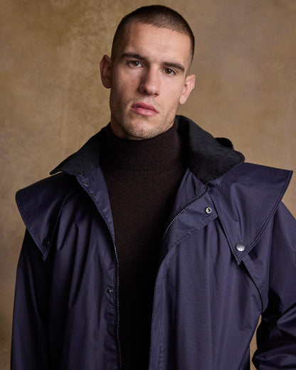 Navy Coloured Jack Murphy Lambourne Mens Long Bush Coat on indoor background 