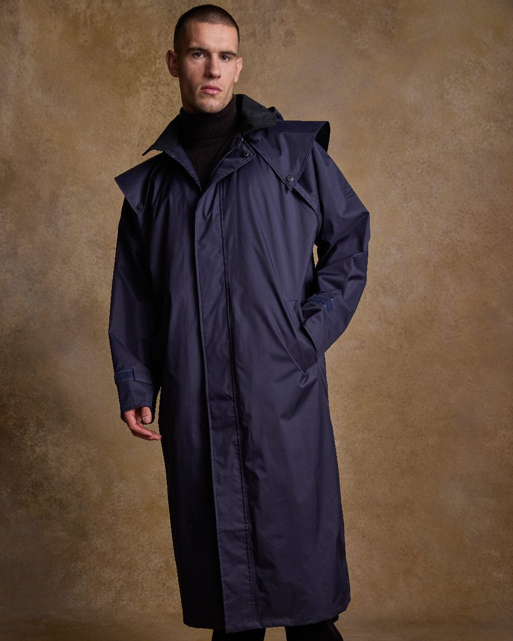Navy Coloured Jack Murphy Lambourne Mens Long Bush Coat on indoor background 