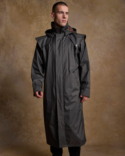 Olive Coloured Jack Murphy Lambourne Mens Long Bush Coat on indoor background 