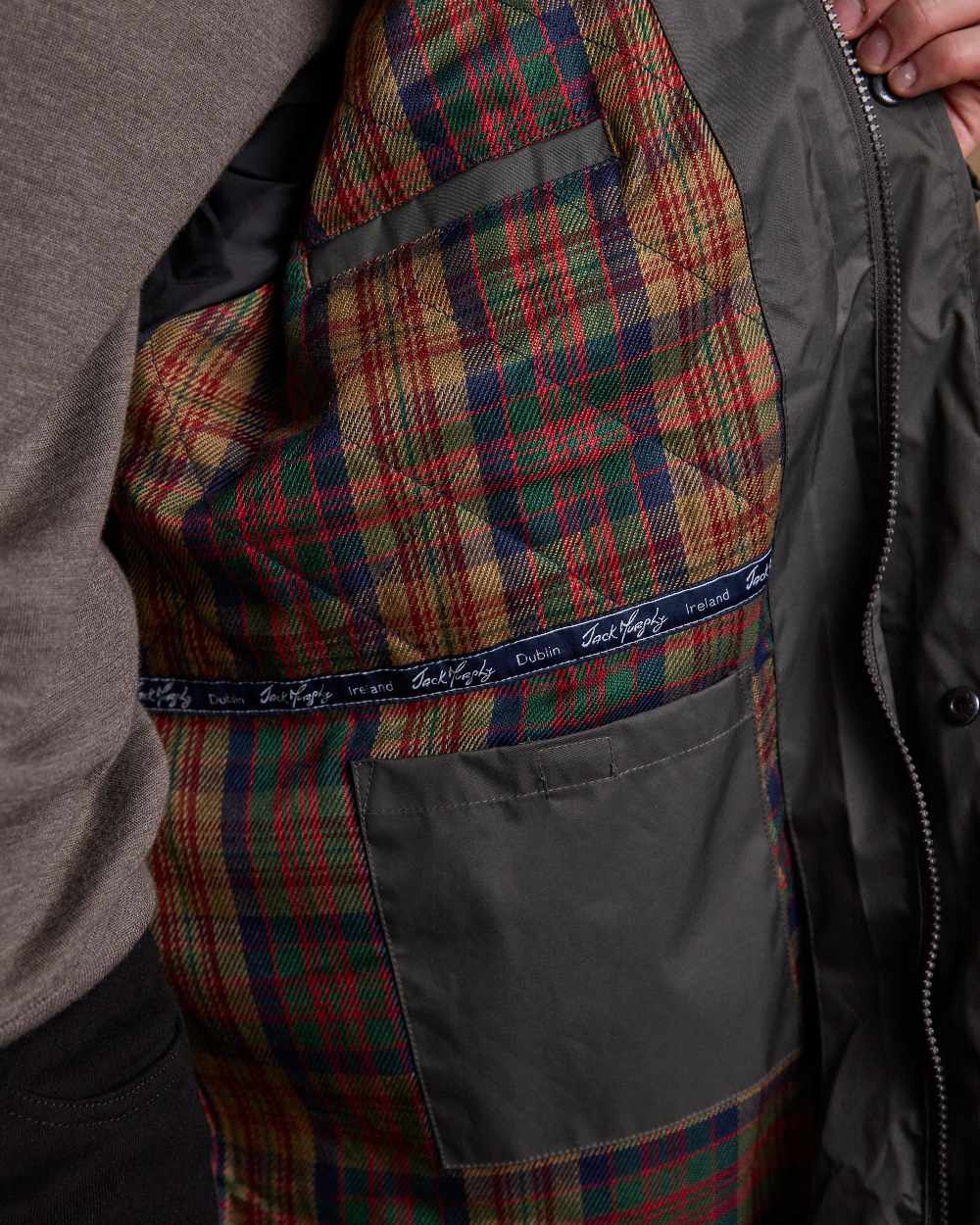 Olive Coloured Jack Murphy Lambourne Mens Long Bush Coat on indoor background 