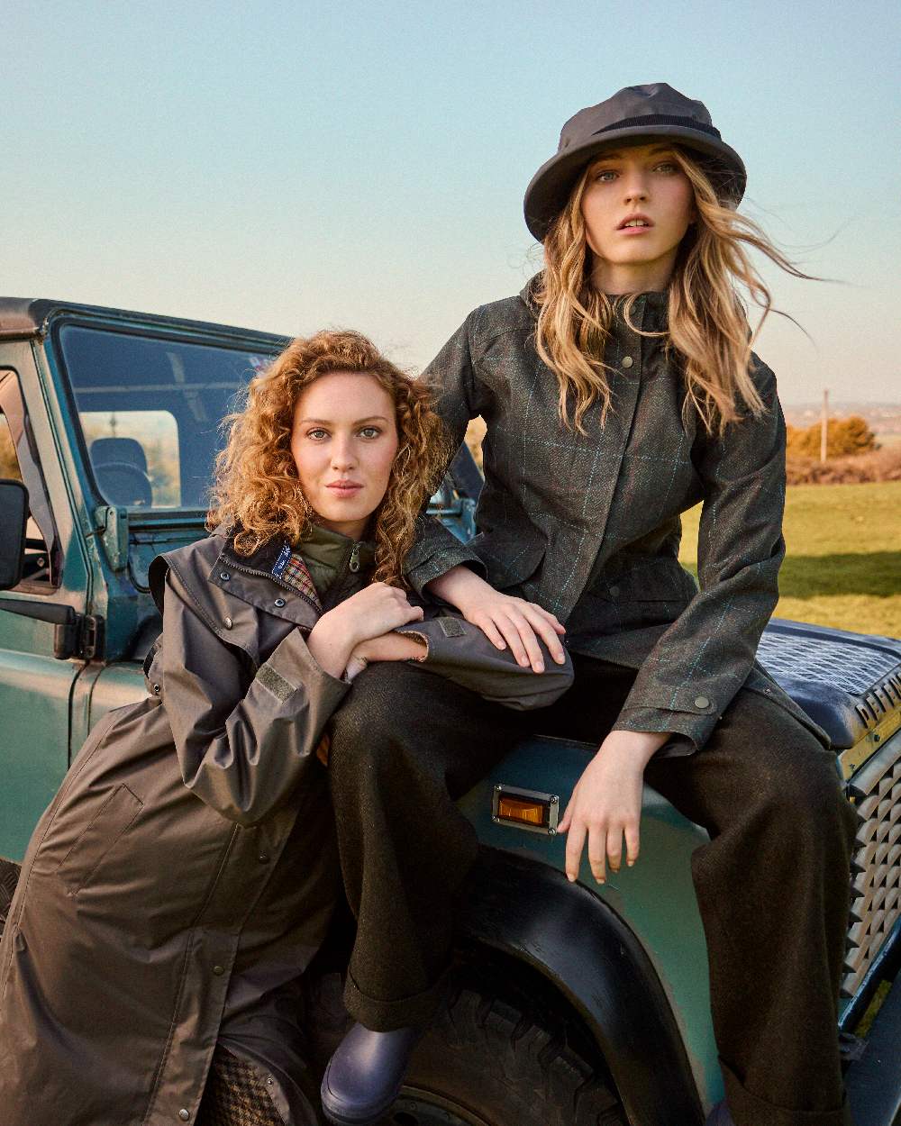 Olive coloured Jack Murphy Malvern Heritage Rain Hat on outdoor background 