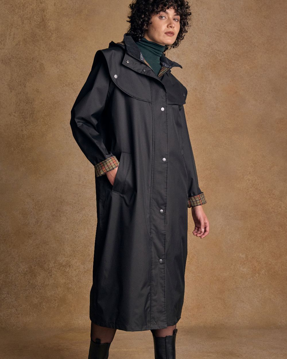Black Coloured Jack Murphy Malvern Ladies Waterproof Bush Coat on indoor background 
