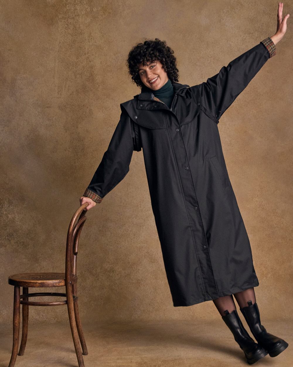 Black Coloured Jack Murphy Malvern Ladies Waterproof Bush Coat on indoor background 