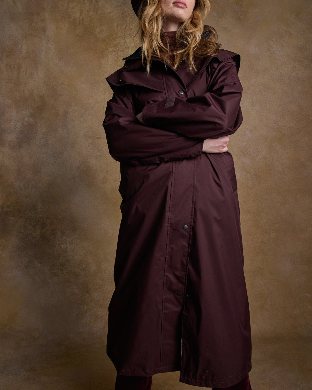 Deep Claret Coloured Jack Murphy Malvern Ladies Waterproof Bush Coat on indoor background 