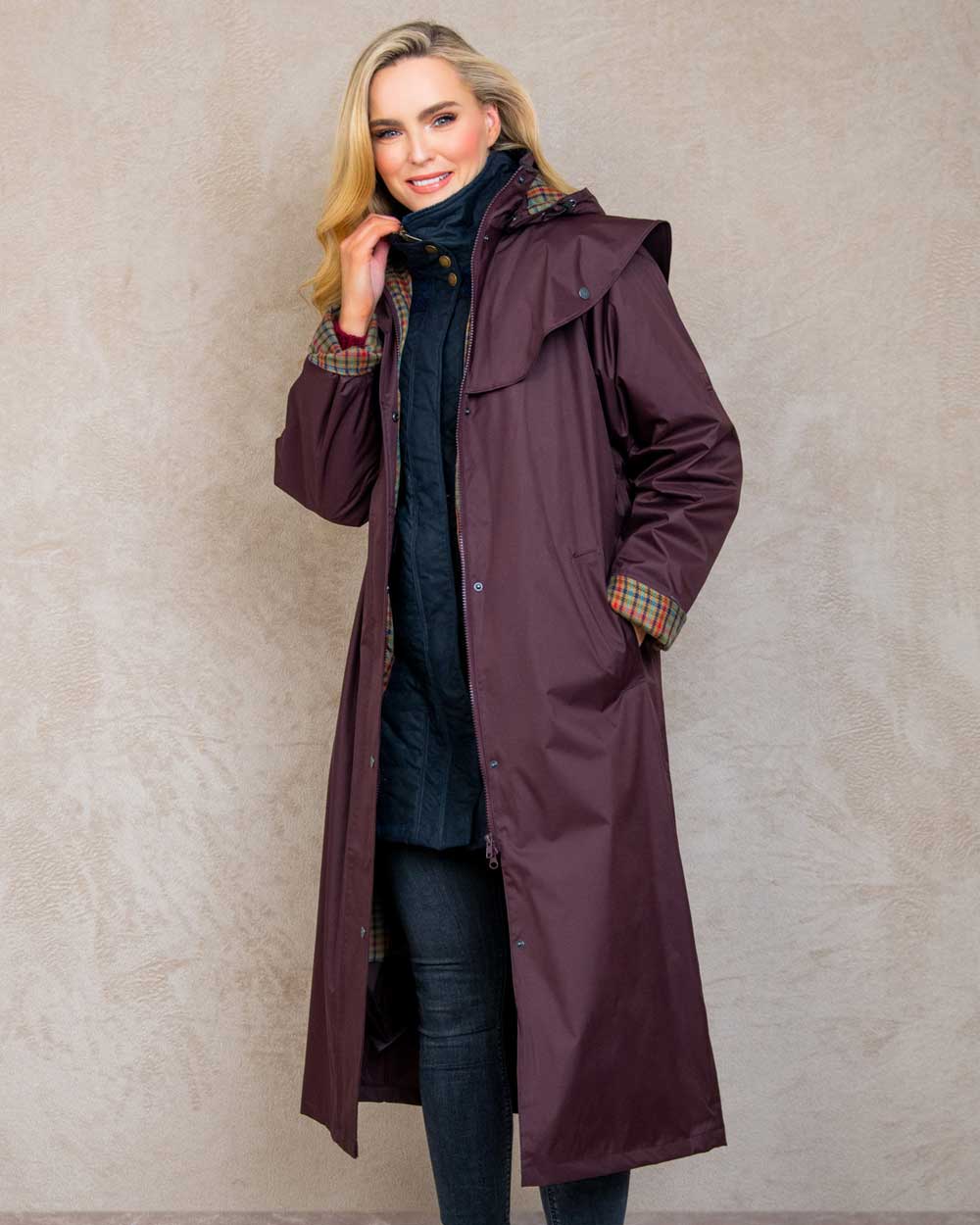 Deep Claret coloured Jack Murphy Malvern Ladies Waterproof Bush Coat on wall background 