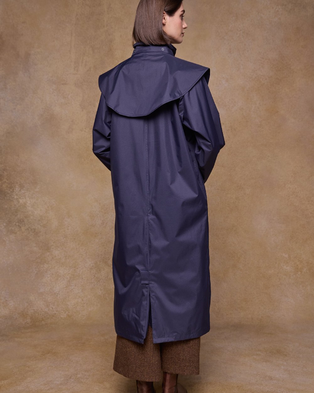 Heritage Navy Coloured Jack Murphy Malvern Ladies Waterproof Bush Coat on indoor background 