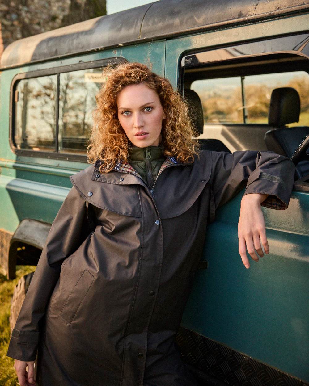 Olive Coloured Jack Murphy Malvern Ladies Waterproof Bush Coat on outdoor background 