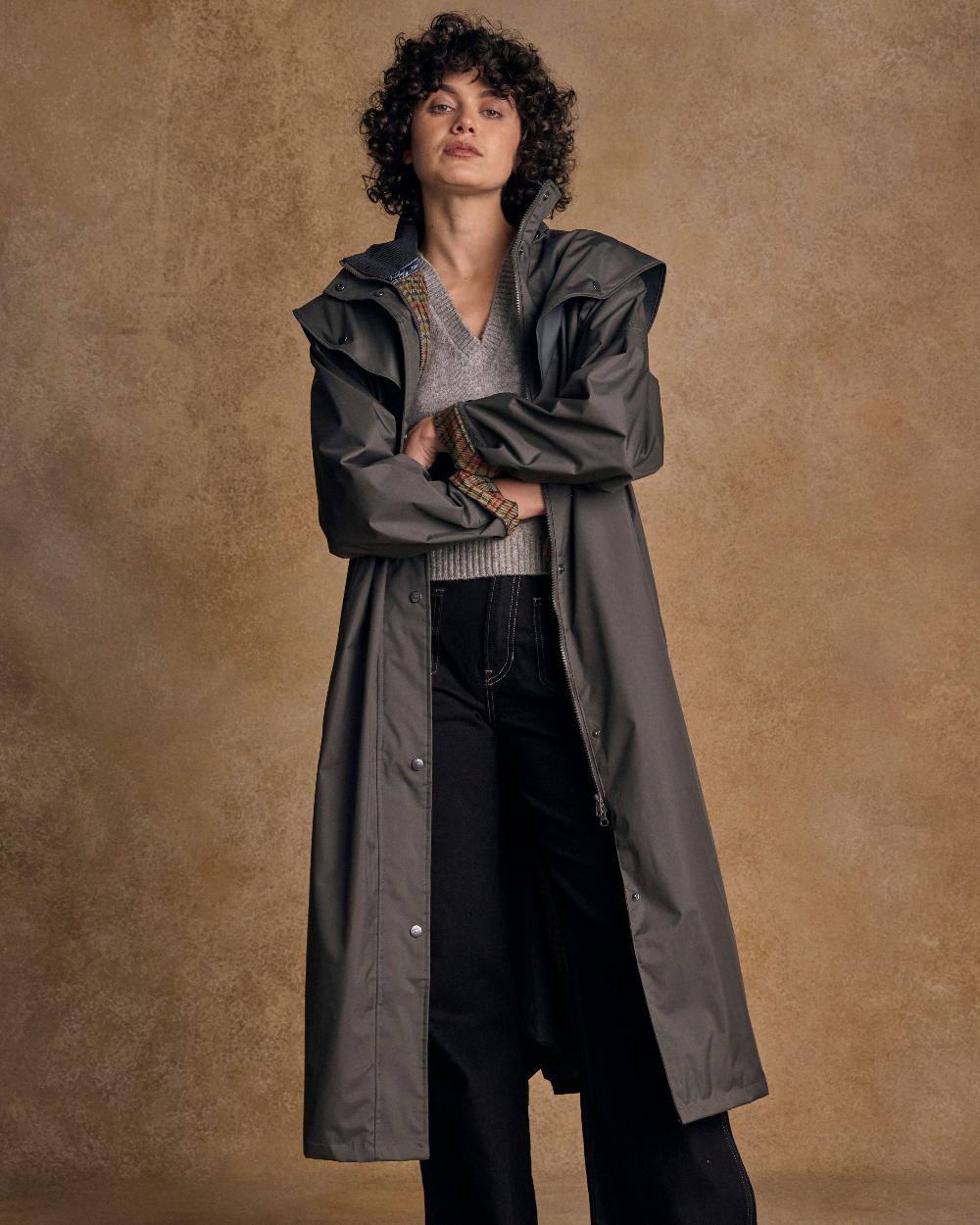 Olive Coloured Jack Murphy Malvern Ladies Waterproof Bush Coat on indoor background 