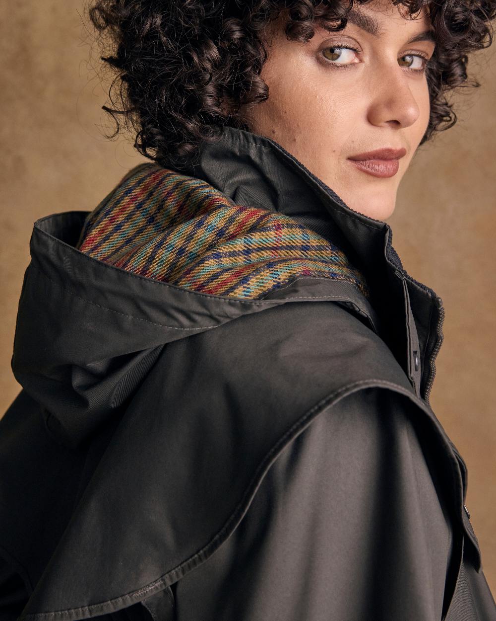 Olive Coloured Jack Murphy Malvern Ladies Waterproof Bush Coat on indoor background 