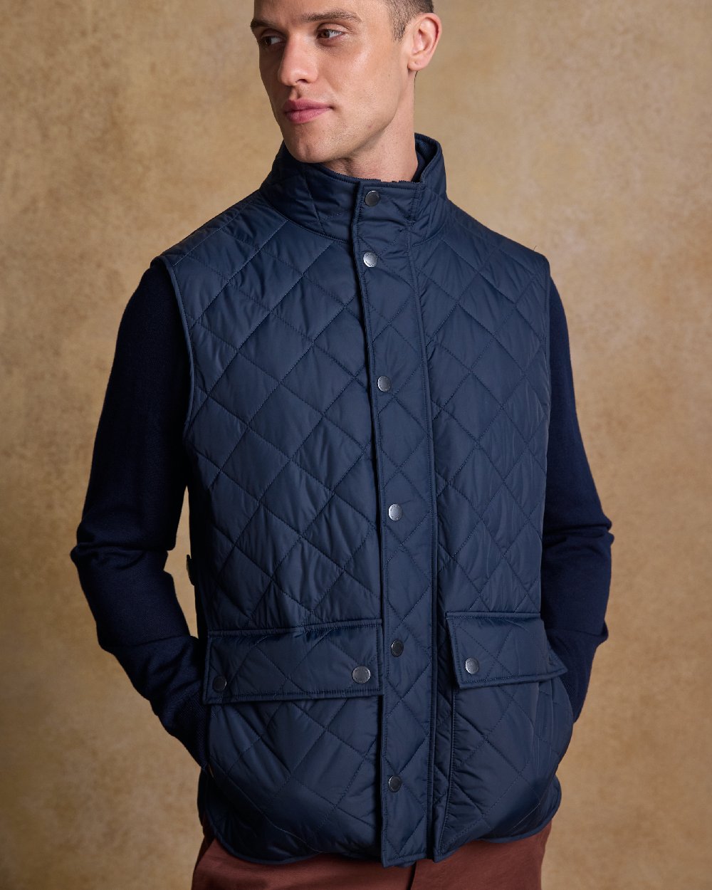 Navy Coloured Jack Murphy Mens Conor Quilted Gilet on indoor background 