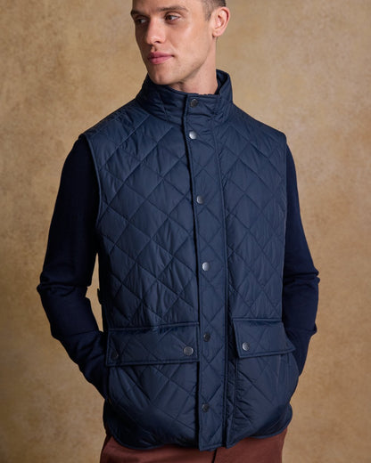 Navy Coloured Jack Murphy Mens Conor Quilted Gilet on indoor background 
