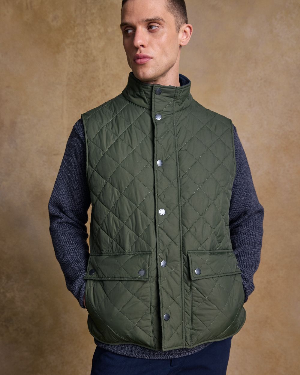 Olive Coloured Jack Murphy Mens Conor Quilted Gilet on indoor background 